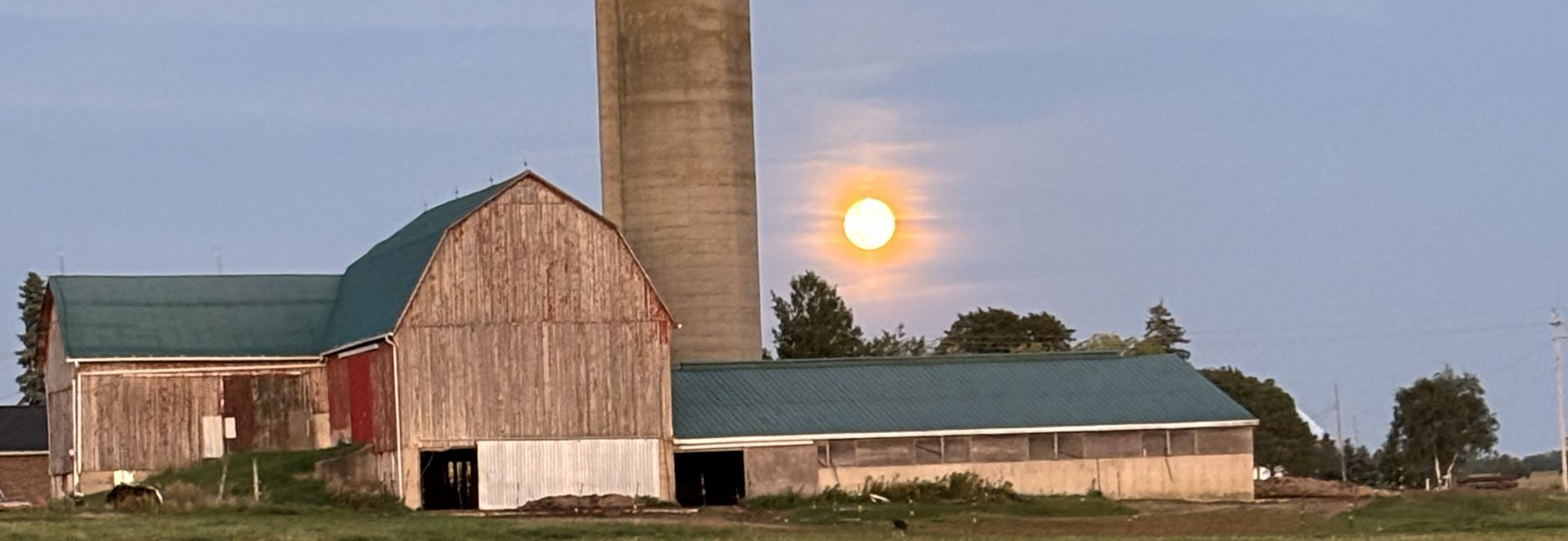 family farm barns with sunset